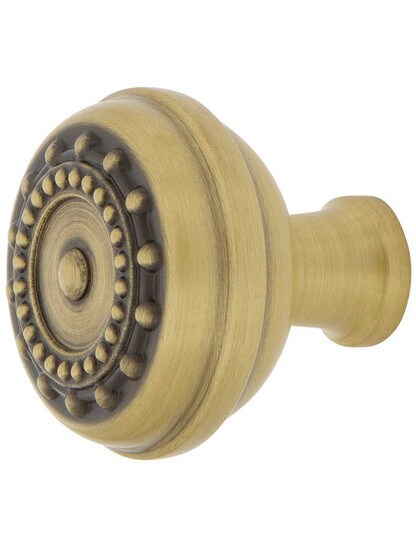 Meadows Cabinet Knob - 1 3/8 inch Diameter in Antique Brass.